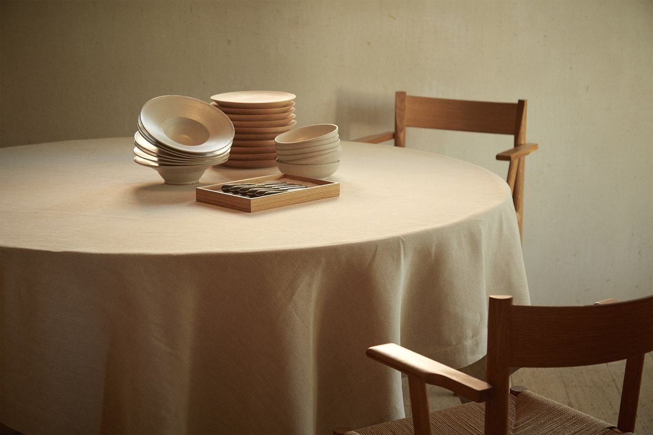 A table at OSA, set with stacked handmade ceramics